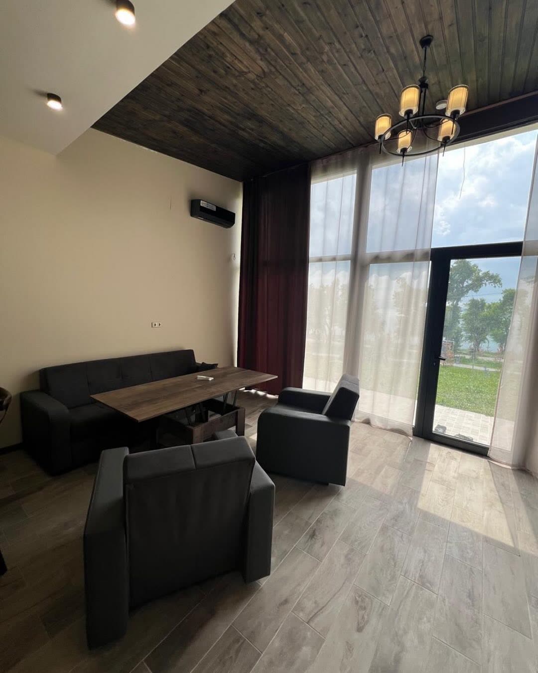 Cottage living room with lake-facing windows